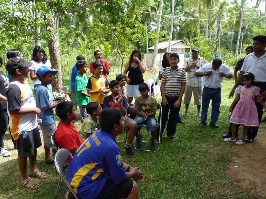 Desert Cubs cricket academy members gathering with children at Sputnik orphanage 2008