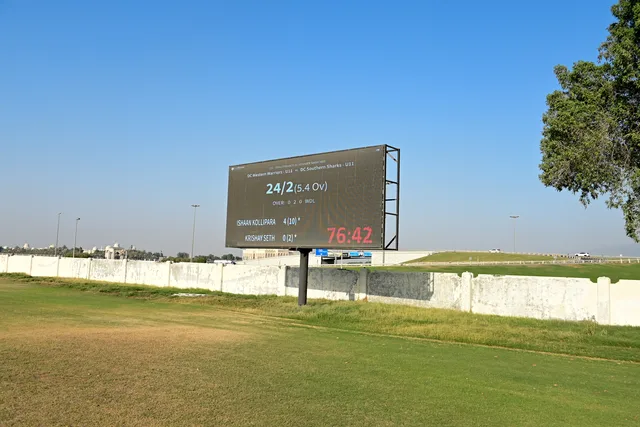 Digital cricket scoreboard beside the SES natural grass ground